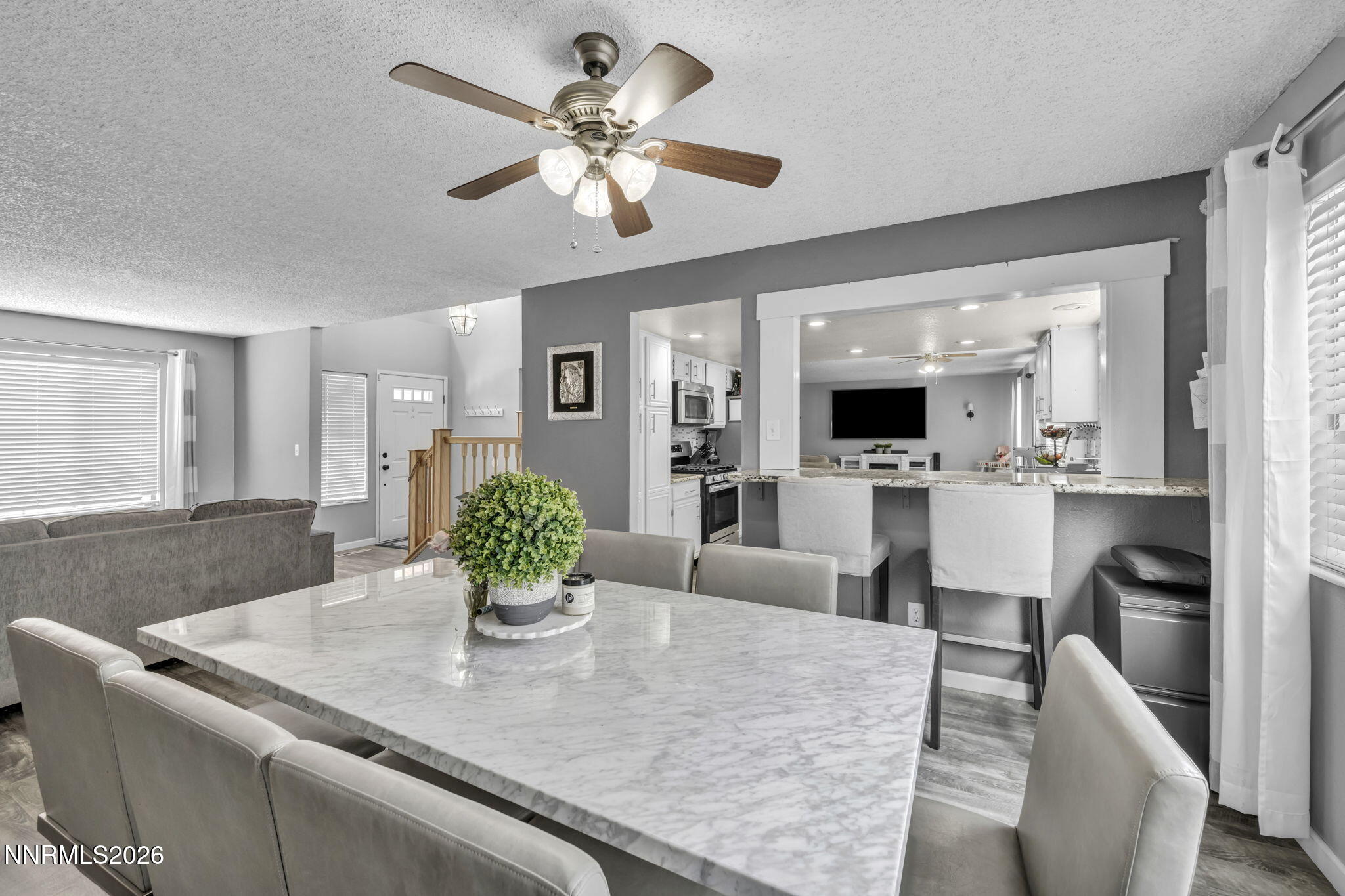 8655 Silver Shores Drive Reno, NV 89506 - Photo 9 of 42 a view of a dining room with furniture and a chandelier