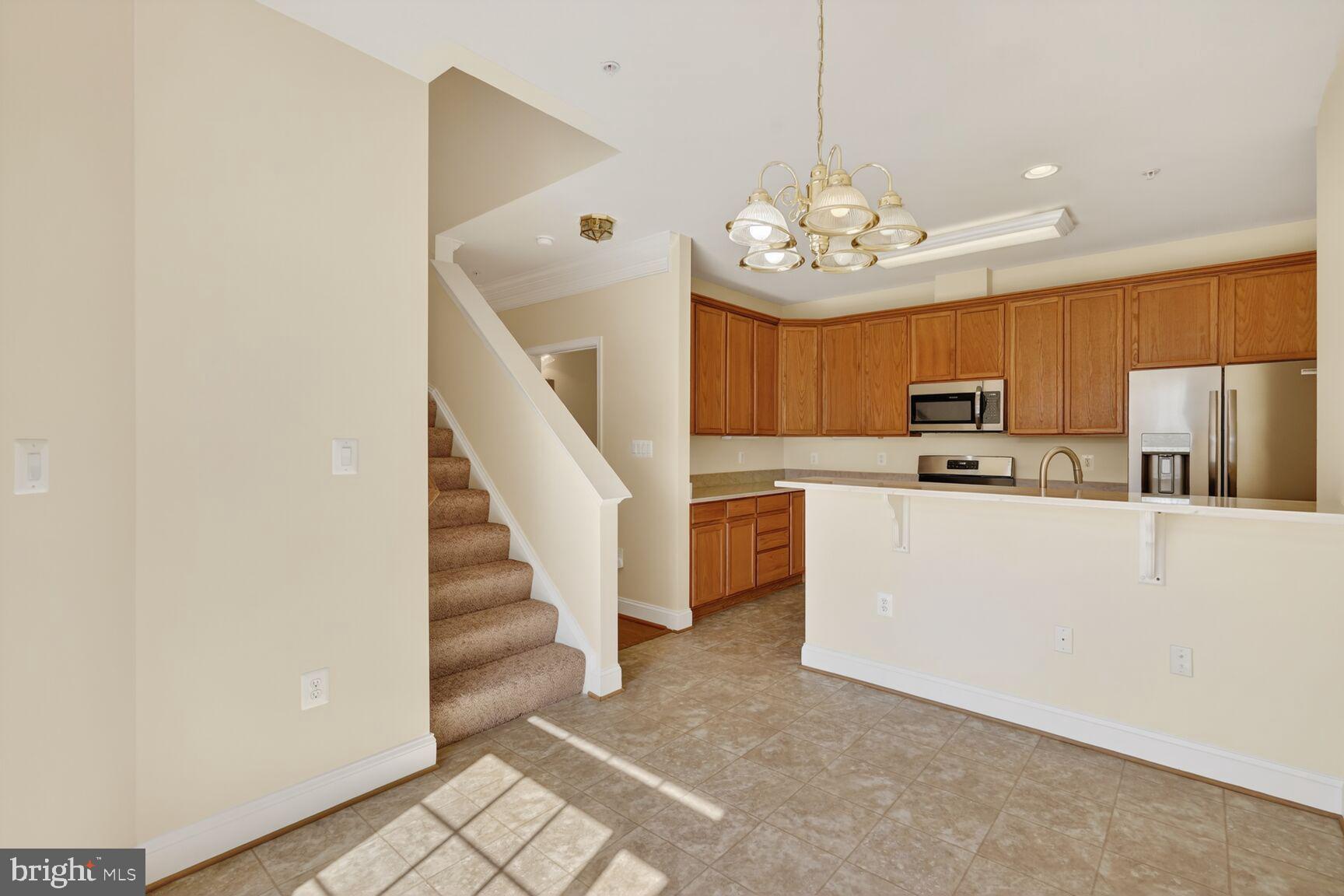 13210 Rabbit Chase Road Laurel, MD 20707 - Photo 13 of 40 a view of kitchen with furniture and a chandelier