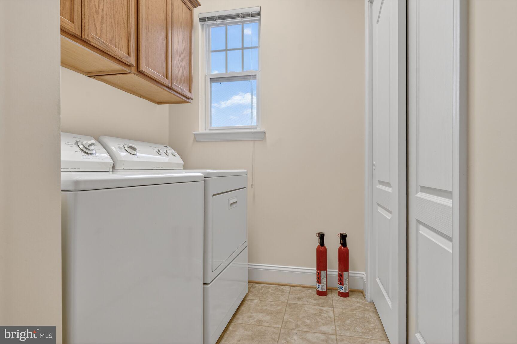 13210 Rabbit Chase Road Laurel, MD 20707 - Photo 15 of 40 a view of a storage & utility room with dryer and washer