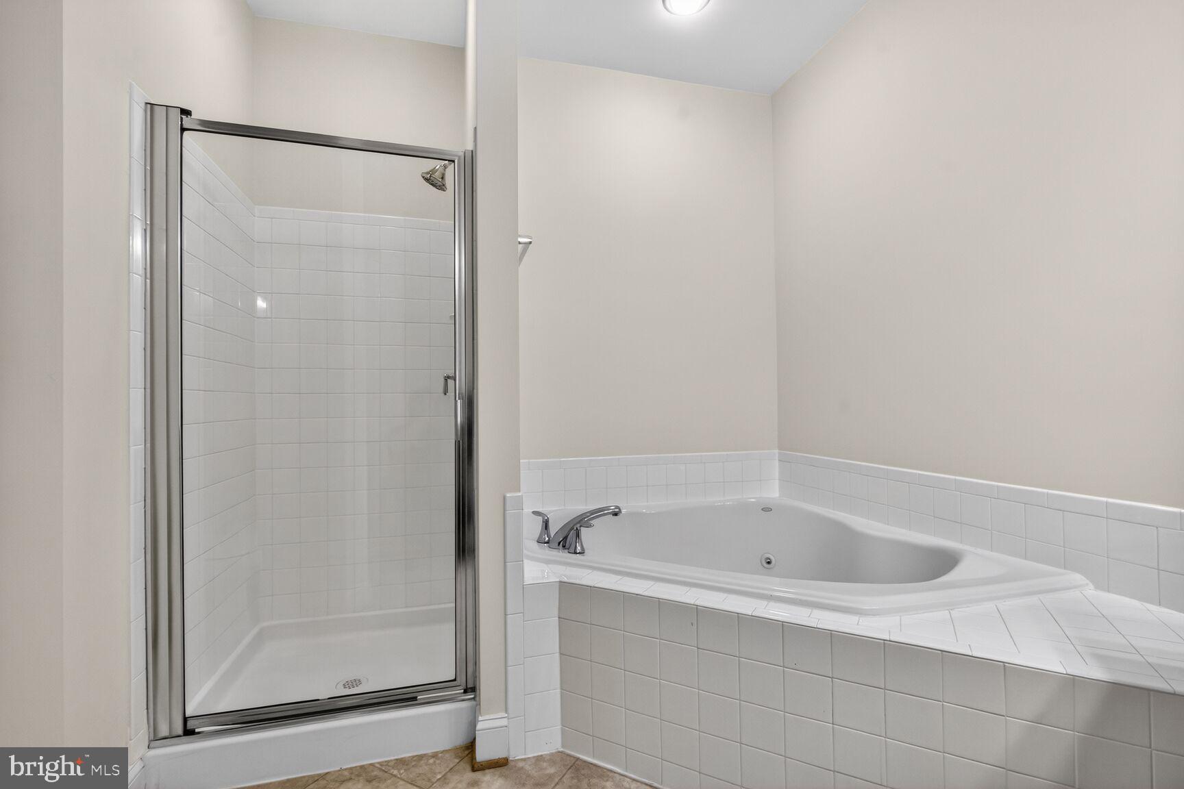 13210 Rabbit Chase Road Laurel, MD 20707 - Photo 18 of 40 a white bath tub sitting next to a shower