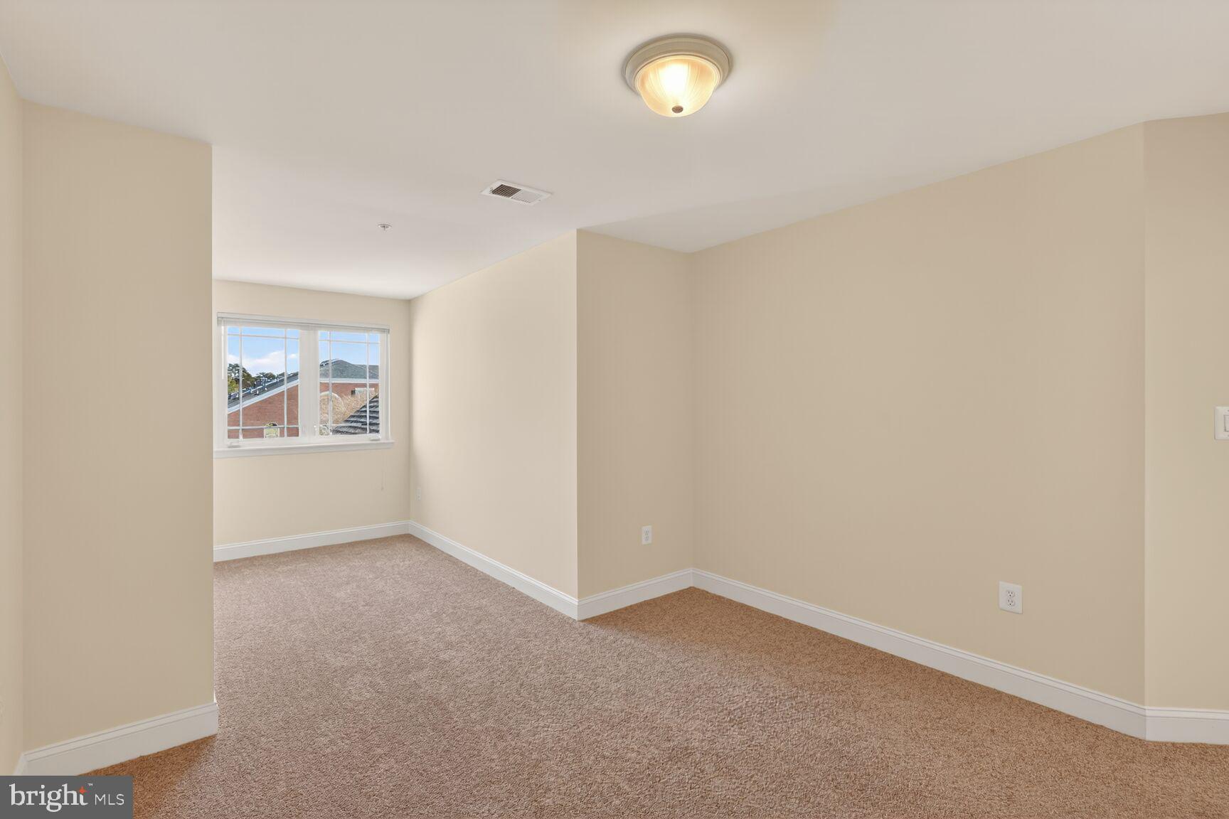 13210 Rabbit Chase Road Laurel, MD 20707 - Photo 26 of 40 an empty room with windows
