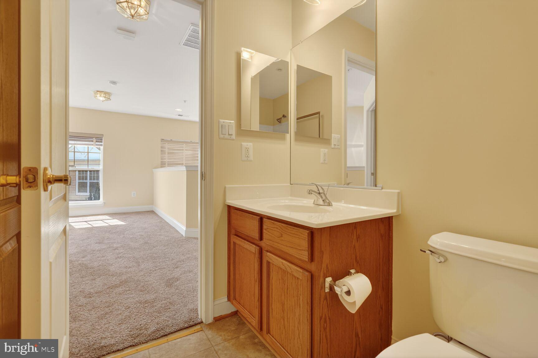 13210 Rabbit Chase Road Laurel, MD 20707 - Photo 28 of 40 a bathroom with a sink a toilet and shower