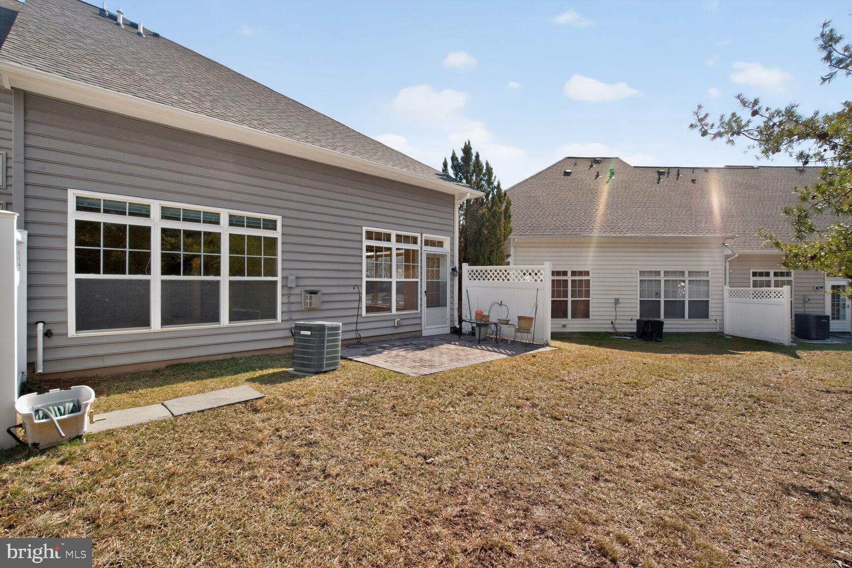 13210 Rabbit Chase Road Laurel, MD 20707 - Photo 4 of 40 a front view of a house with a yard and seating space