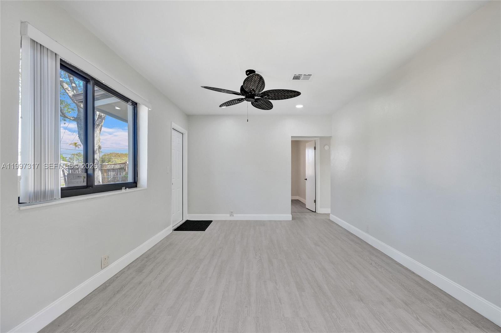 136 Miami Gardens Road West Park, FL 33023 - Photo 13 of 44 a view of an empty room with a window
