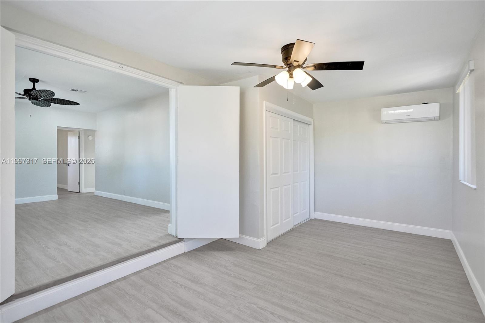 136 Miami Gardens Road West Park, FL 33023 - Photo 15 of 44 a view of empty room with wooden floor