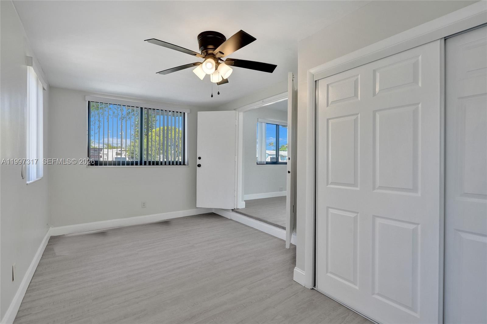 136 Miami Gardens Road West Park, FL 33023 - Photo 16 of 44 a view of an empty room with a window