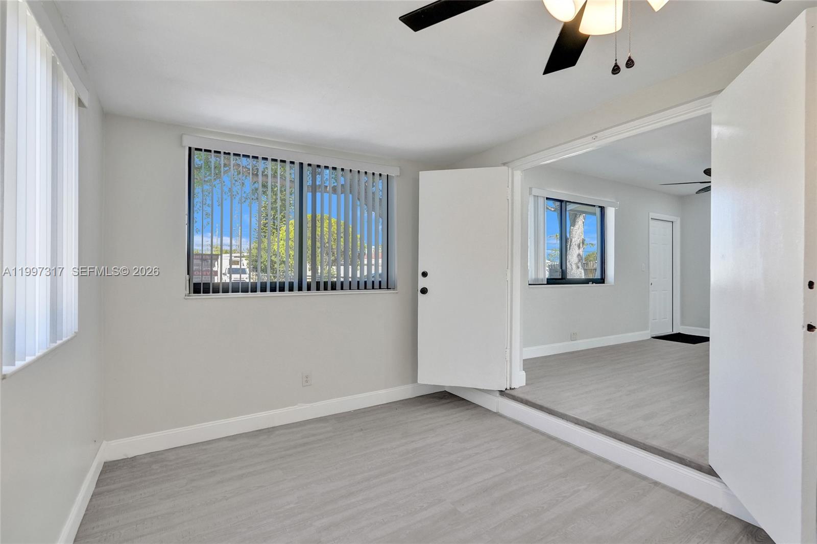 136 Miami Gardens Road West Park, FL 33023 - Photo 17 of 44 a view of an empty room with a window