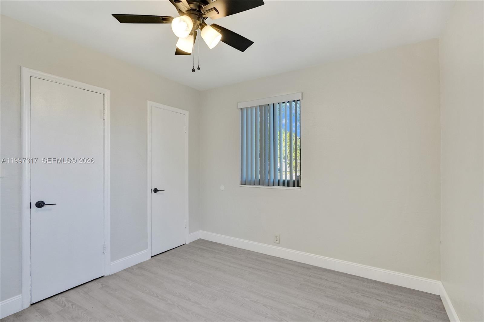 136 Miami Gardens Road West Park, FL 33023 - Photo 22 of 44 a view of an empty room with a window