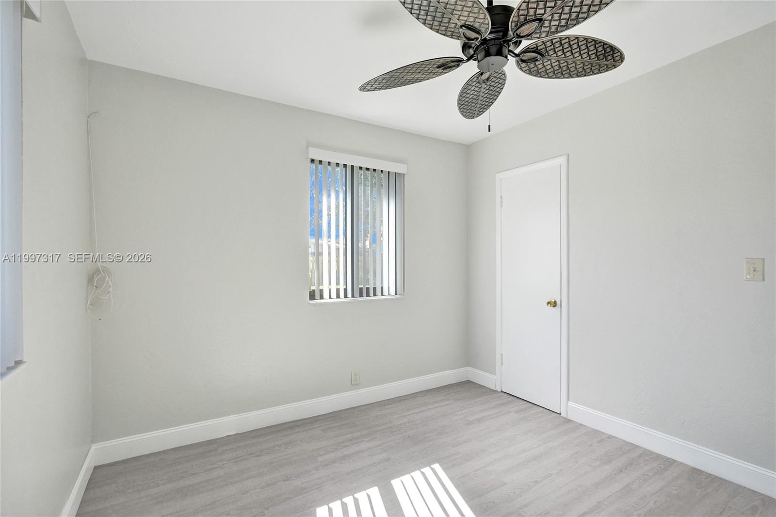 136 Miami Gardens Road West Park, FL 33023 - Photo 29 of 44 a view of an empty room with a window