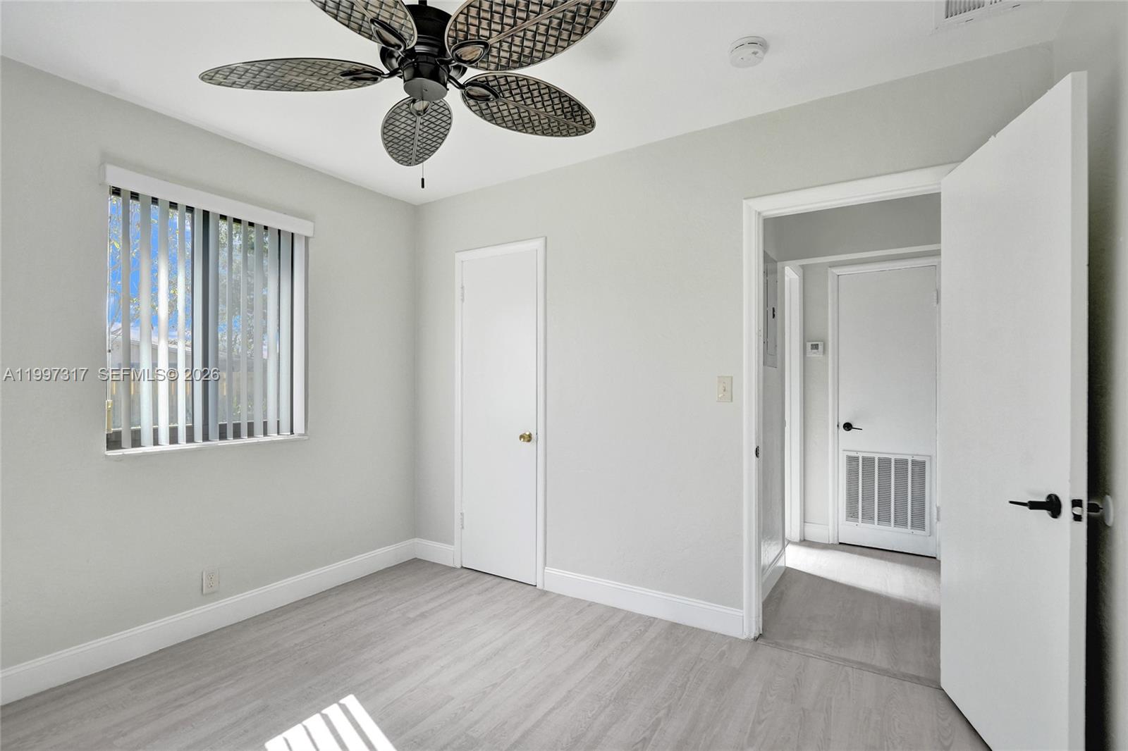 136 Miami Gardens Road West Park, FL 33023 - Photo 30 of 44 a view of an empty room with a ceiling fan