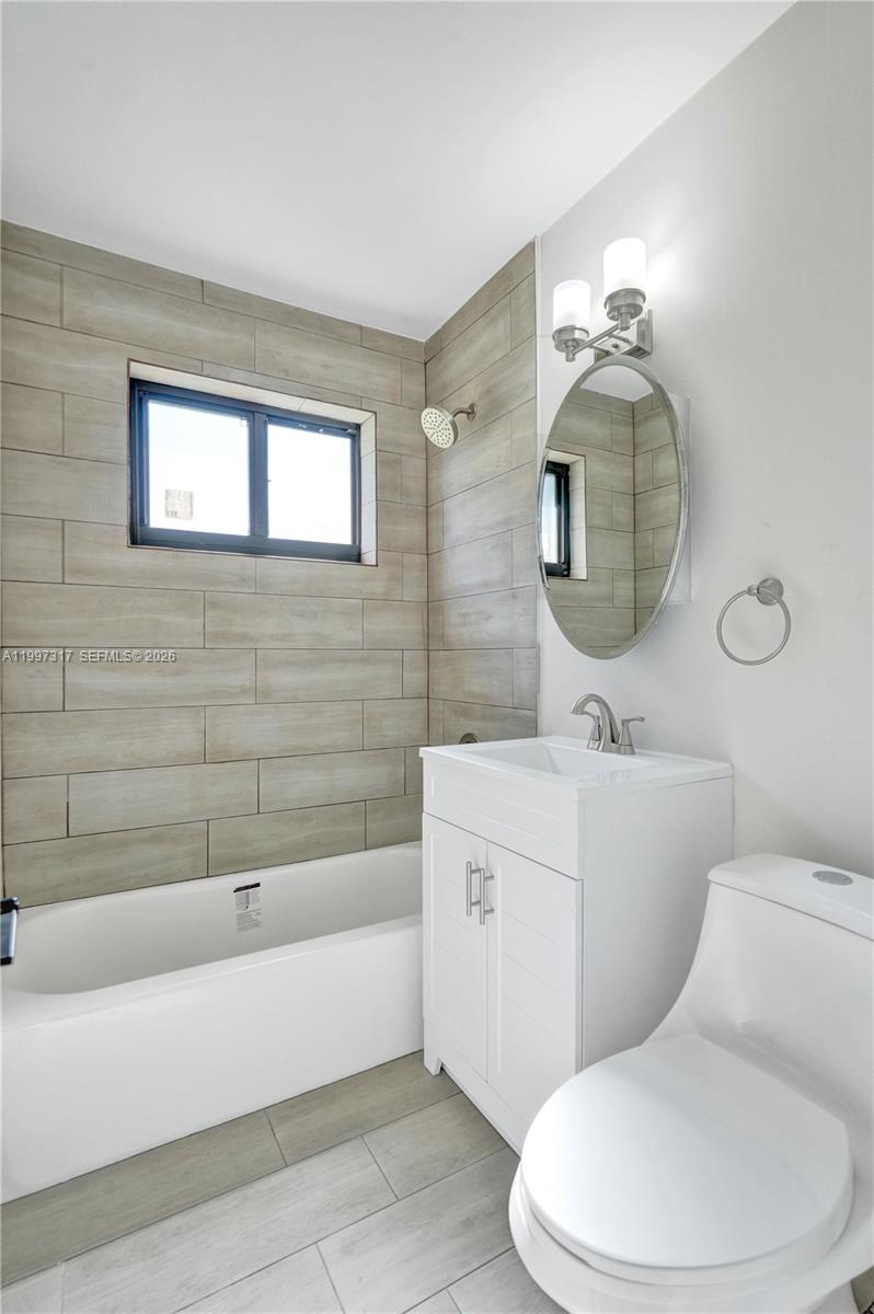 136 Miami Gardens Road West Park, FL 33023 - Photo 34 of 44 a bathroom with a toilet a sink and bathtub