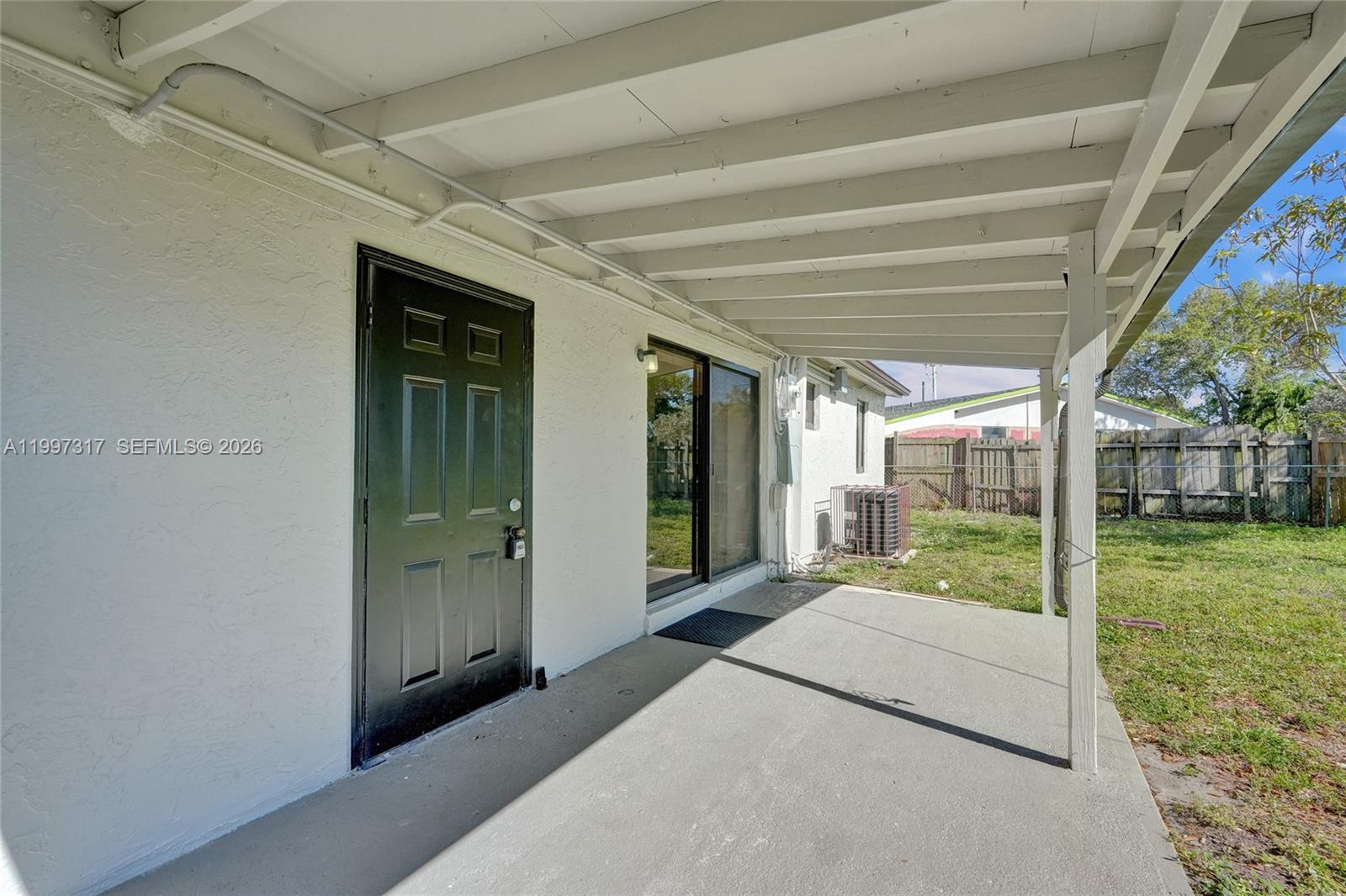 136 Miami Gardens Road West Park, FL 33023 - Photo 36 of 44 a bedroom with a bed and a large window