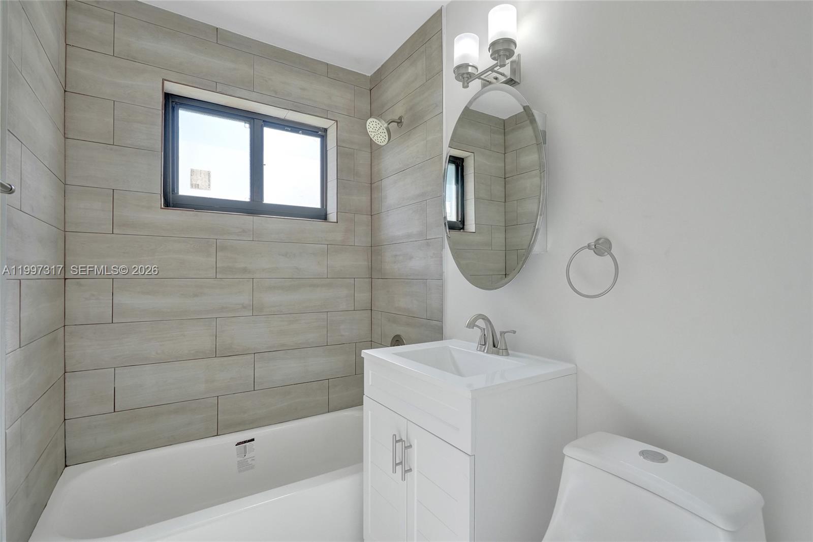 136 Miami Gardens Road West Park, FL 33023 - Photo 4 of 44 a bathroom with a sink a toilet and shower