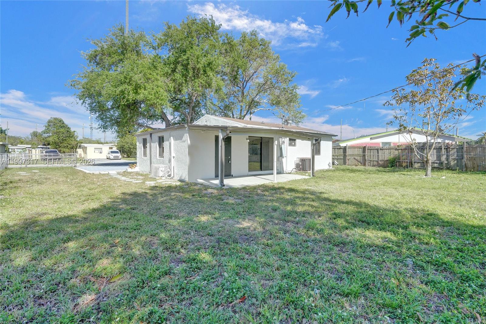 136 Miami Gardens Road West Park, FL 33023 - Photo 41 of 44 a house view with a garden space