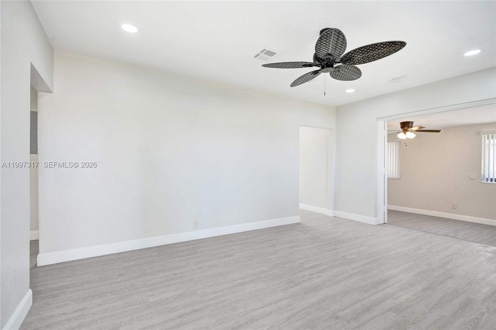 136 Miami Gardens Road West Park, FL 33023 - Photo 8 of 44 wooden floor in an empty room