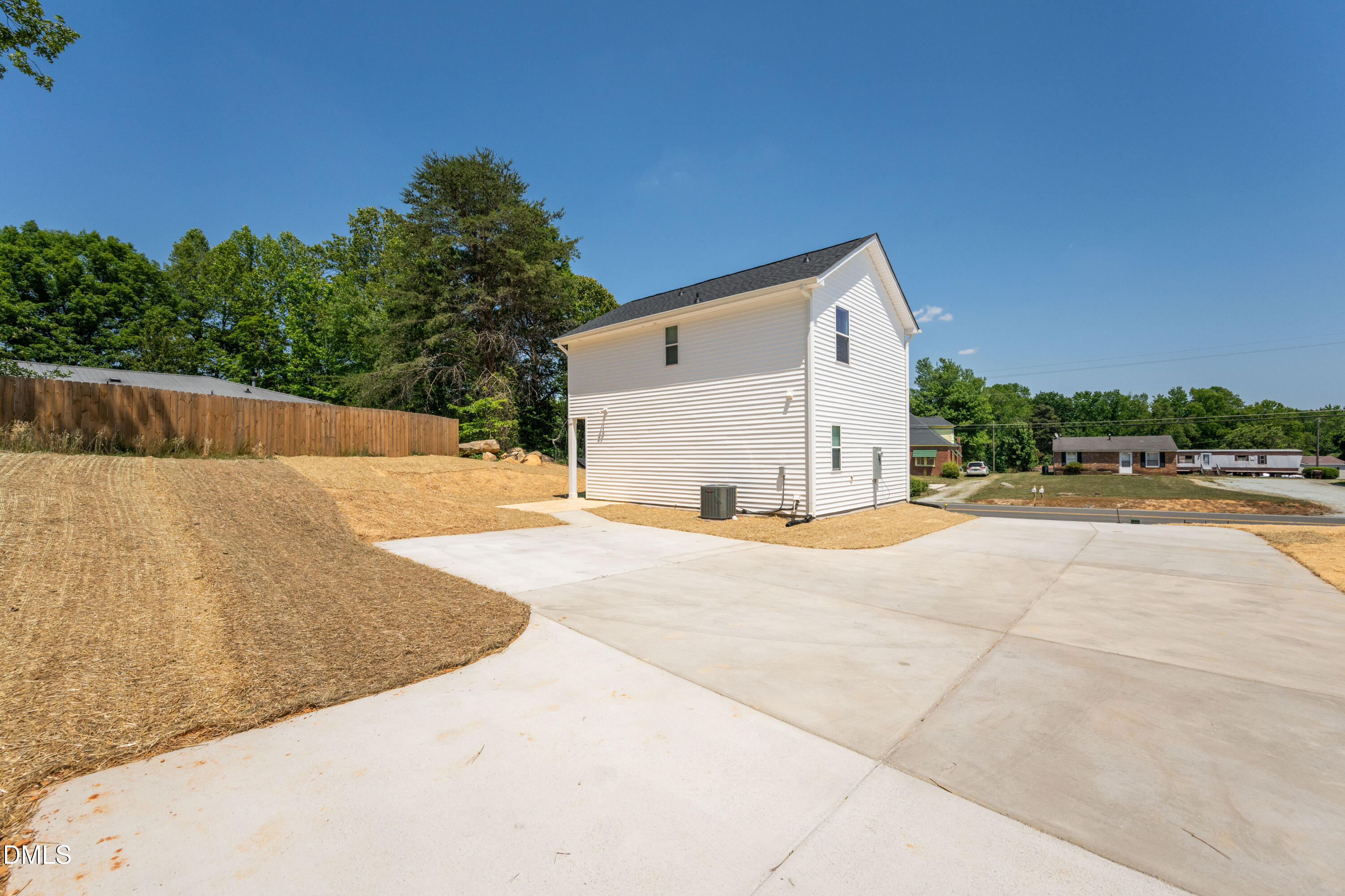 1182 Hurdle Mills Road Roxboro, NC 27573 - Photo 42 of 45 a view of a house with backyard and trees
