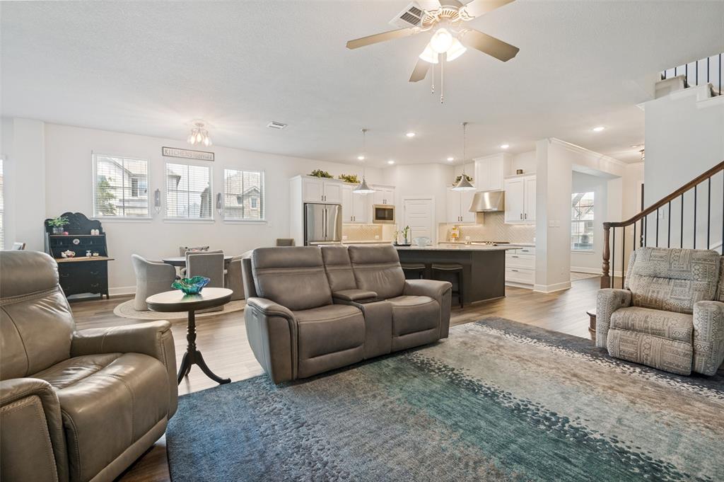 4724 Raspberry Spar Court Arlington, TX 76005 - Photo 12 of 40 a living room with furniture and a view of kitchen