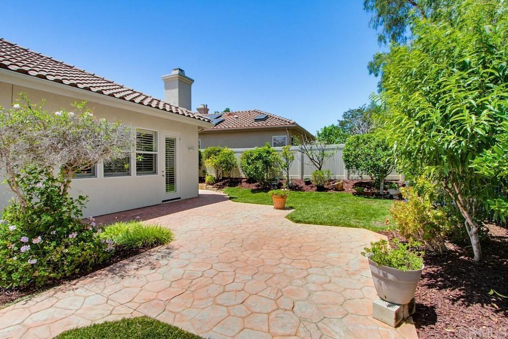 672 Inverlochy Drive Fallbrook, CA 92028 - Photo 56 of 75 a front view of a house with a yard and potted plants