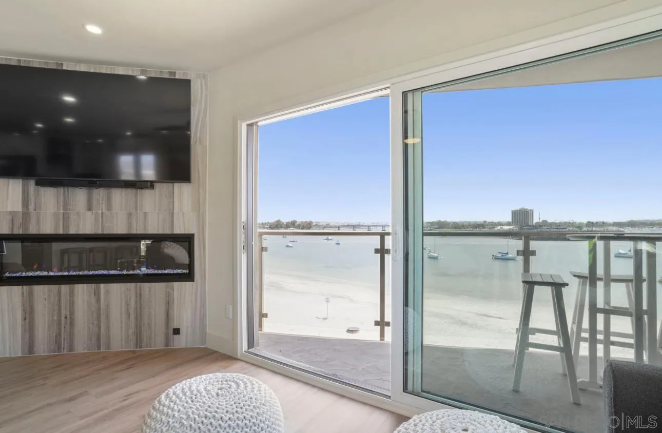 2820 Bayside Walk, Unit 2 San Diego, CA 92109 - Photo 1 of 16 a bathroom with a glass shower door and a bathtub