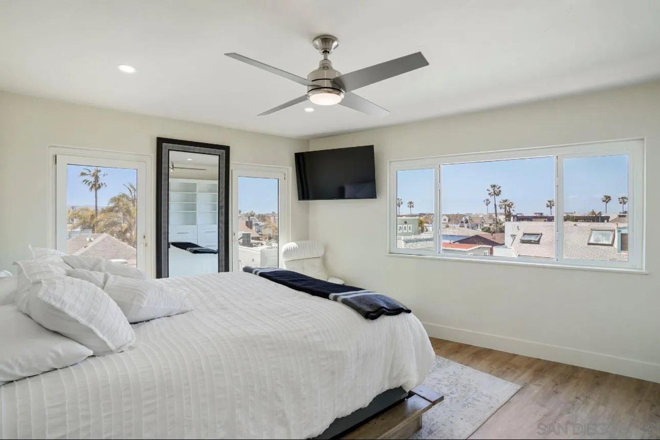 2820 Bayside Walk, Unit 2 San Diego, CA 92109 - Photo 11 of 16 a bedroom with a bed window and a flat screen tv
