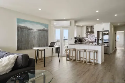 a kitchen with a stove and a white cabinets