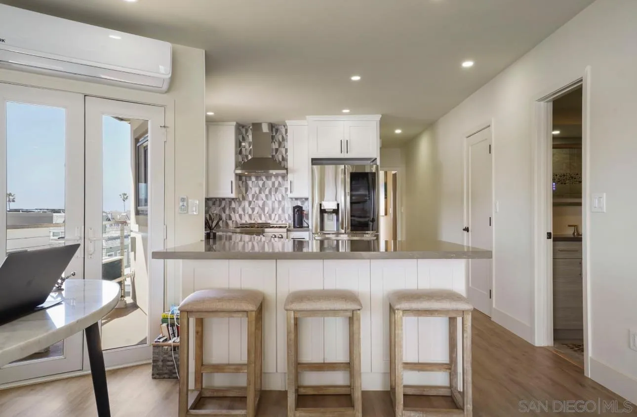 2820 Bayside Walk, Unit 2 San Diego, CA 92109 - Photo 9 of 16 a kitchen with a table and chairs