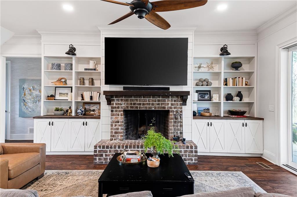 7093 Vaughn Road Woodstock, GA 30188 - Photo 16 of 86 a living room with furniture and a fireplace