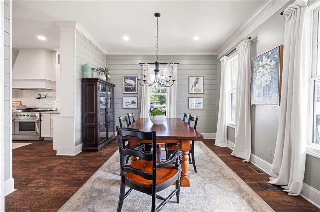 7093 Vaughn Road Woodstock, GA 30188 - Photo 28 of 86 a view of a dining room with furniture window and wooden floor