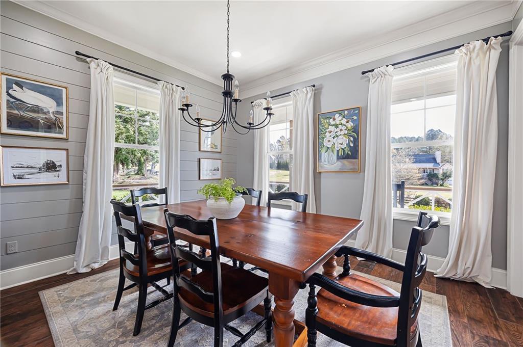 7093 Vaughn Road Woodstock, GA 30188 - Photo 29 of 86 a view of a dining room with furniture window and wooden floor