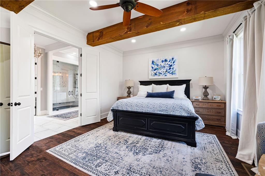 7093 Vaughn Road Woodstock, GA 30188 - Photo 35 of 86 a bedroom with a bed and wooden floor