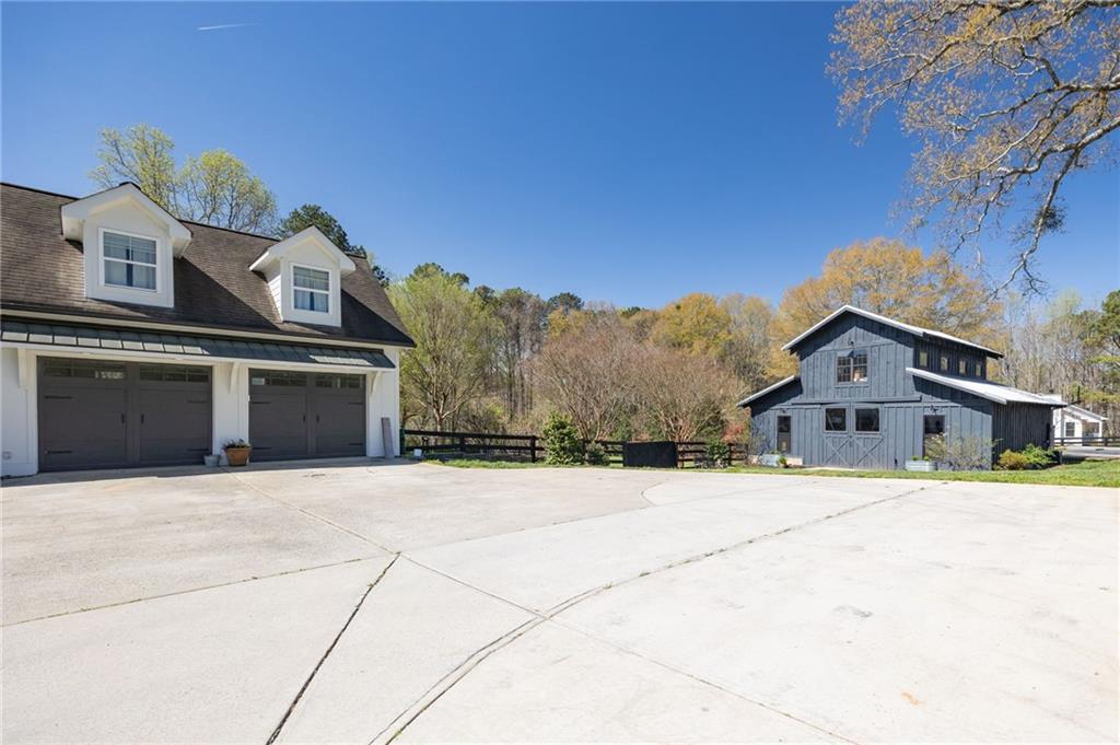 7093 Vaughn Road Woodstock, GA 30188 - Photo 70 of 86 a front view of a house with a yard