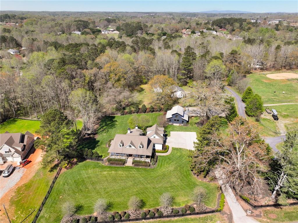 7093 Vaughn Road Woodstock, GA 30188 - Photo 78 of 86 an aerial view of a house with a yard