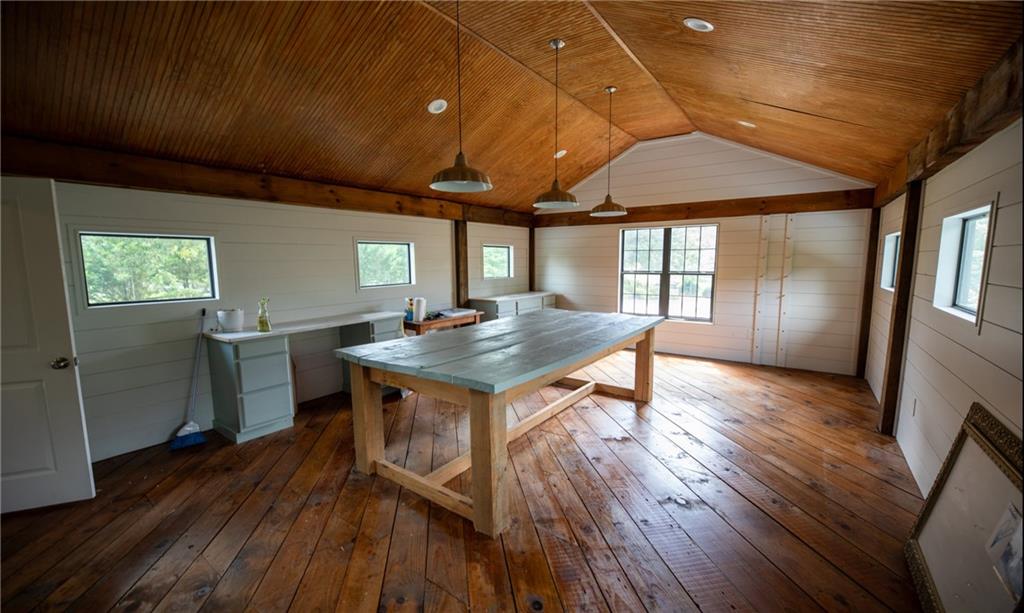 7093 Vaughn Road Woodstock, GA 30188 - Photo 85 of 86 a kitchen with a wooden floor and outdoor view