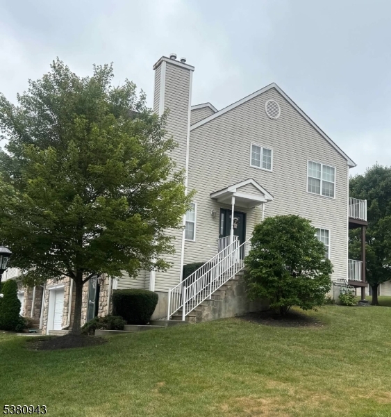 a house view with a garden space