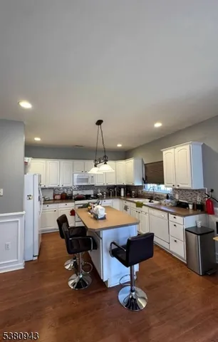 a bathroom with a sink toilet and a mirror