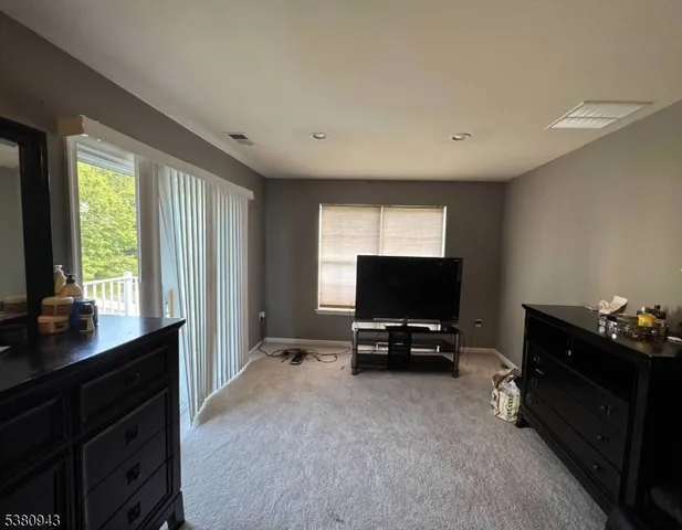 a bathroom with a sink a toilet and tub