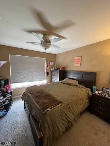 a room with furniture and a flat screen tv