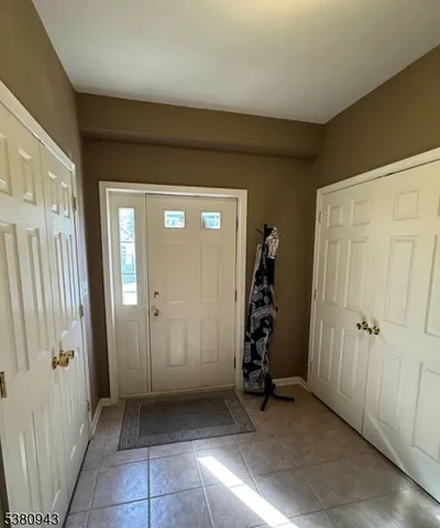 an entryway view with a wooden door