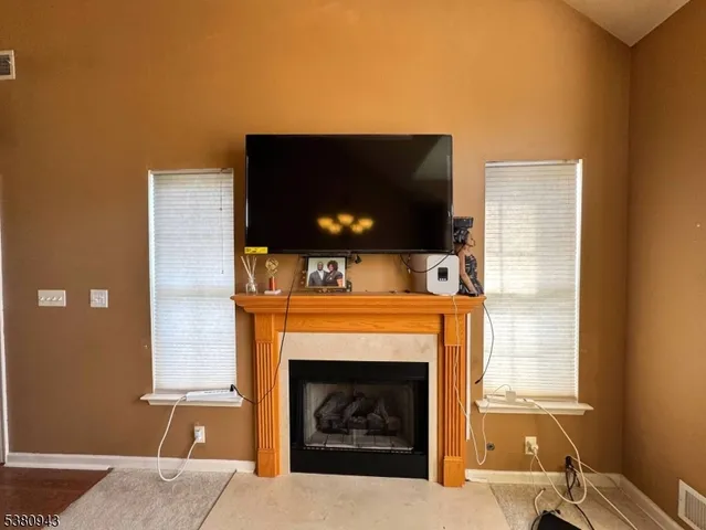 a room with furniture and a flat screen tv