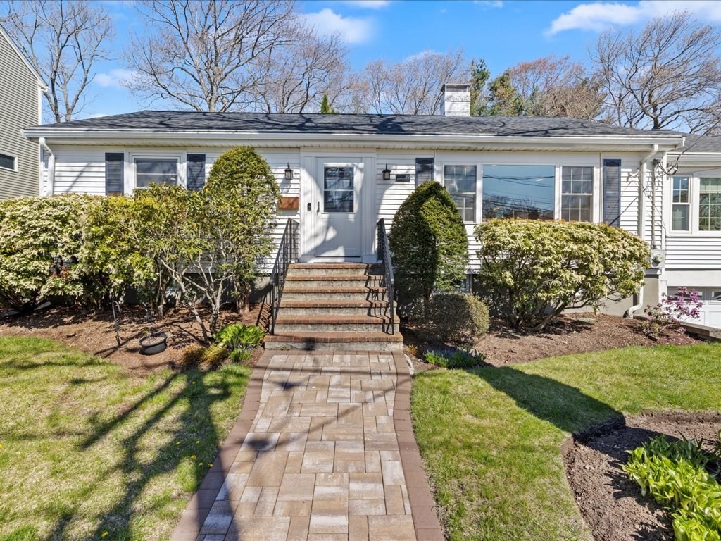 39 Broad Meadow Road Needham, MA 02492 - Photo 1 of 36 a view of a house with a yard and potted plants