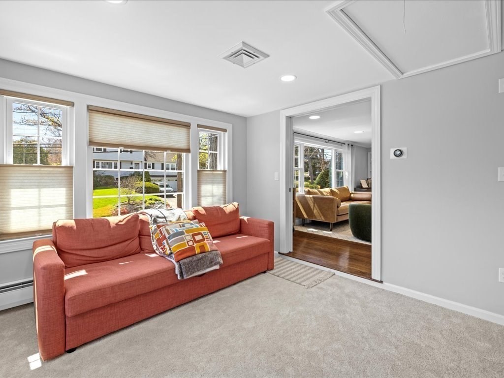 39 Broad Meadow Road Needham, MA 02492 - Photo 17 of 36 a living room with furniture and a large window