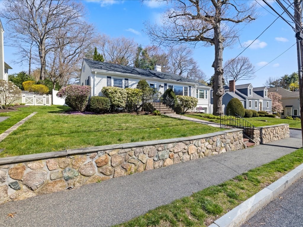 39 Broad Meadow Road Needham, MA 02492 - Photo 2 of 36 a view of a house with a big yard and potted plants