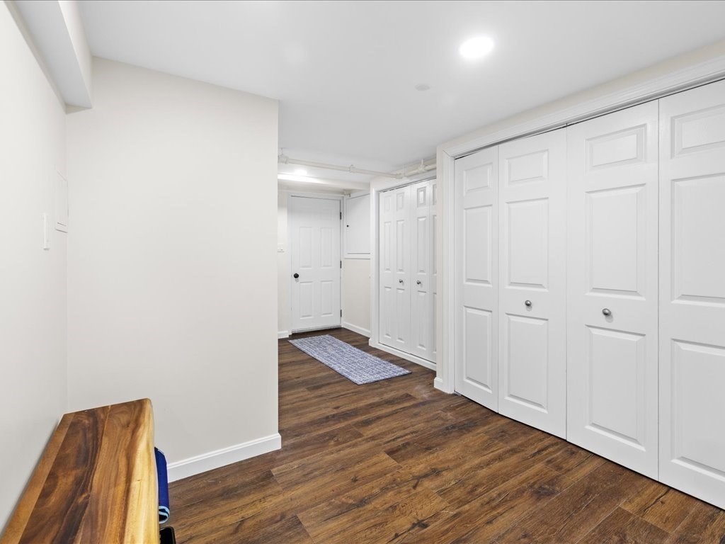 39 Broad Meadow Road Needham, MA 02492 - Photo 31 of 36 a view of empty room with wooden floor