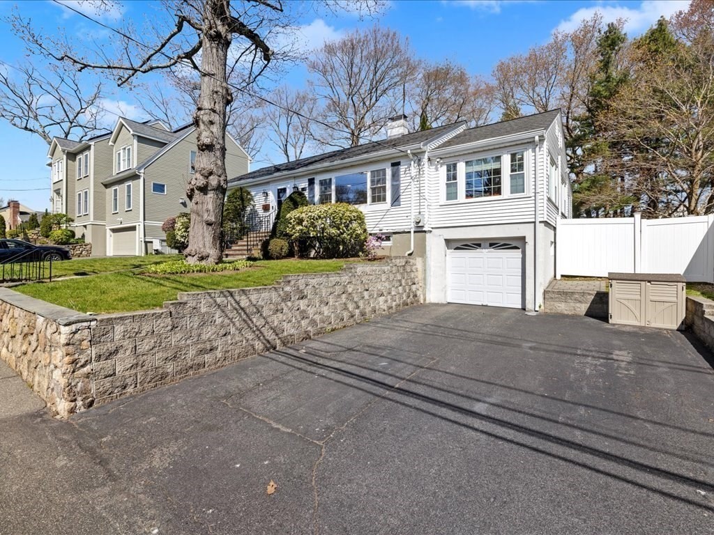 39 Broad Meadow Road Needham, MA 02492 - Photo 36 of 36 a view of a house with a yard and garage
