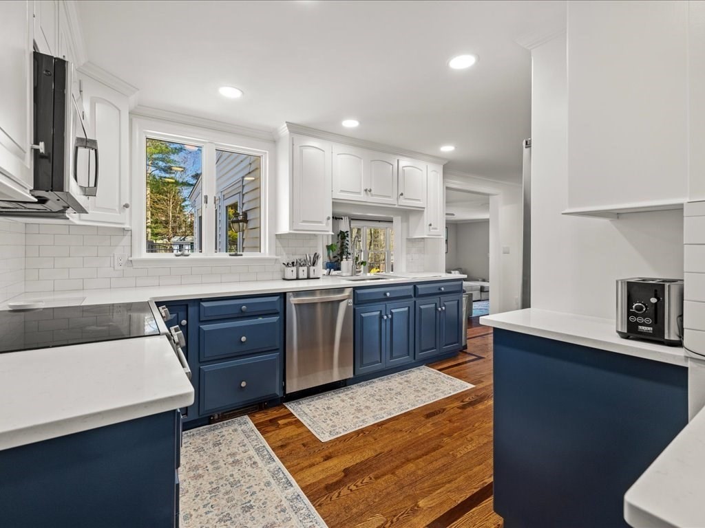 39 Broad Meadow Road Needham, MA 02492 - Photo 4 of 36 a kitchen with a sink stove and microwave