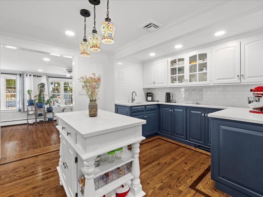 39 Broad Meadow Road Needham, MA 02492 - Photo 7 of 36 a kitchen with a sink refrigerator and cabinets