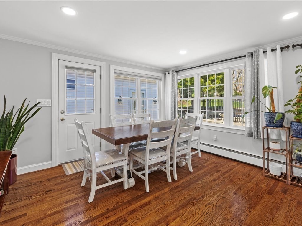 39 Broad Meadow Road Needham, MA 02492 - Photo 9 of 36 a view of a dining room with furniture window and wooden floor