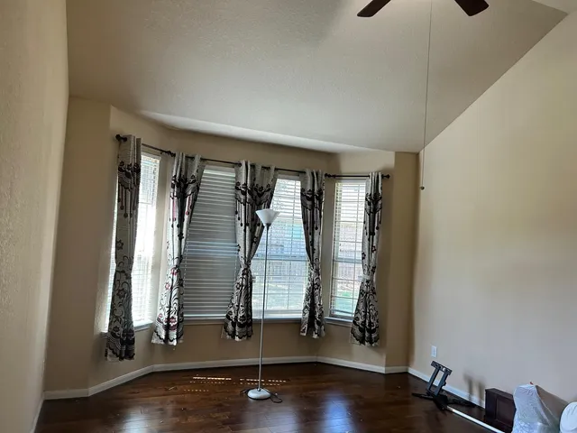 a room with gym equipment and a window