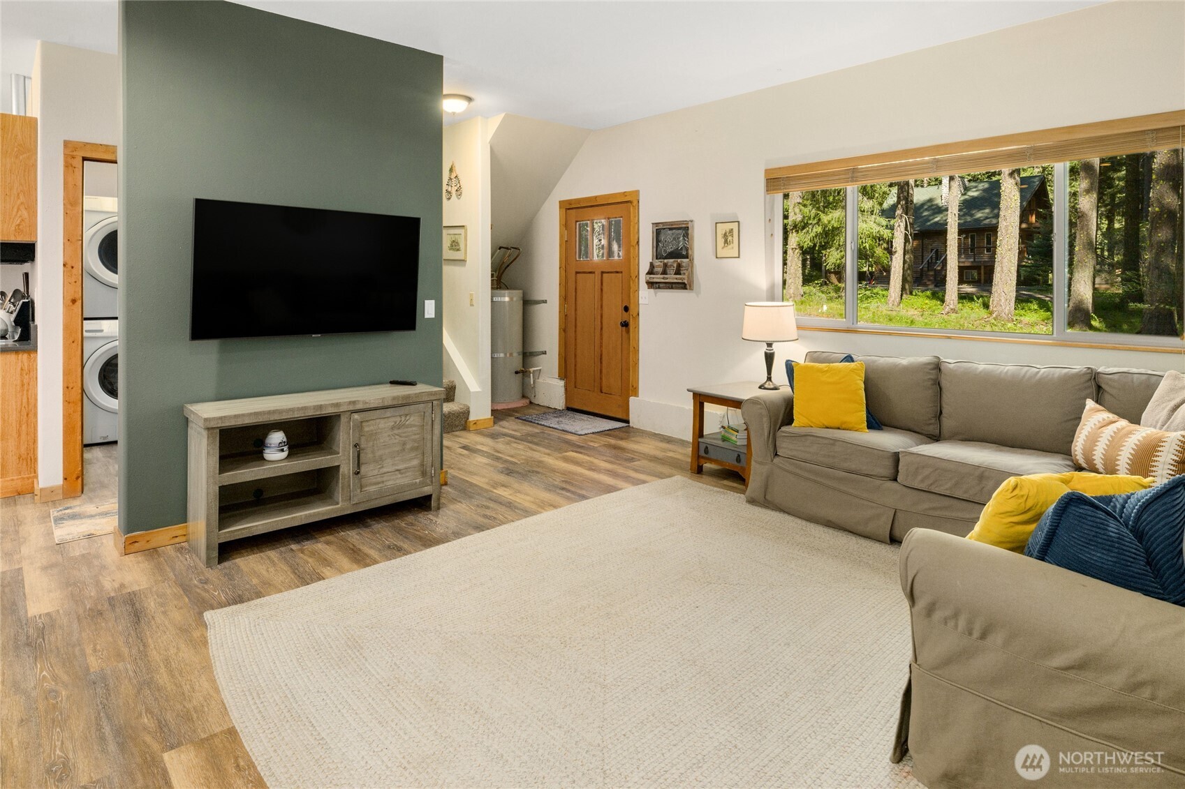 401 Whyworry Lane Ronald, WA 98940 - Photo 2 of 23 a living room with furniture a flat screen tv and a fireplace