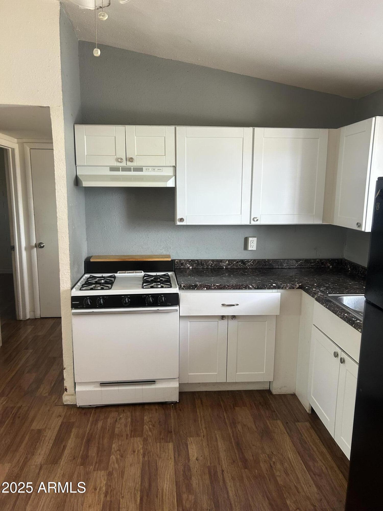 1801 West Carol Avenue, Unit 3 Phoenix, AZ 85021 - Photo 5 of 10 a kitchen with a sink and a stove